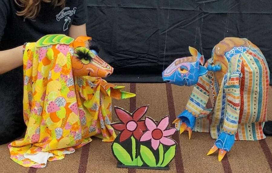 photo of two armadillo puppets